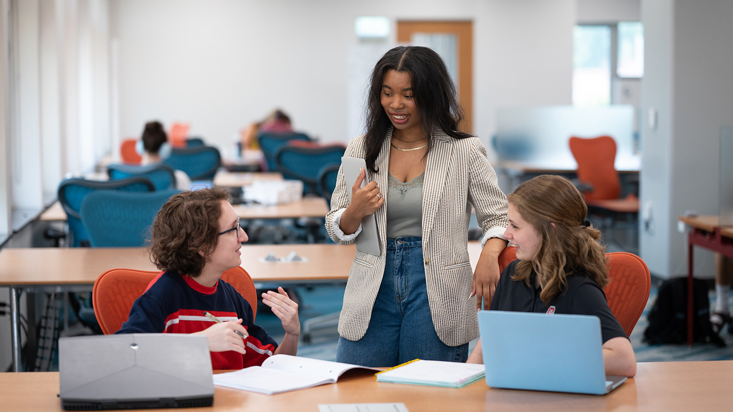 NC State students study together in a library common space.