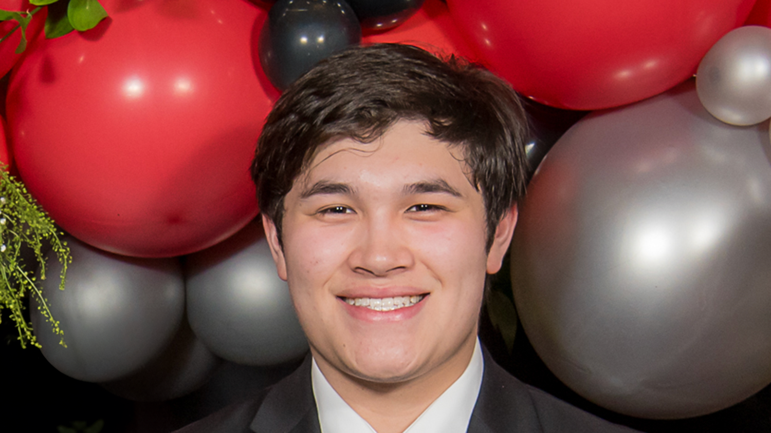 A photo of Thomas Nguyen at the NC State College of Education's Scholarship Banquet