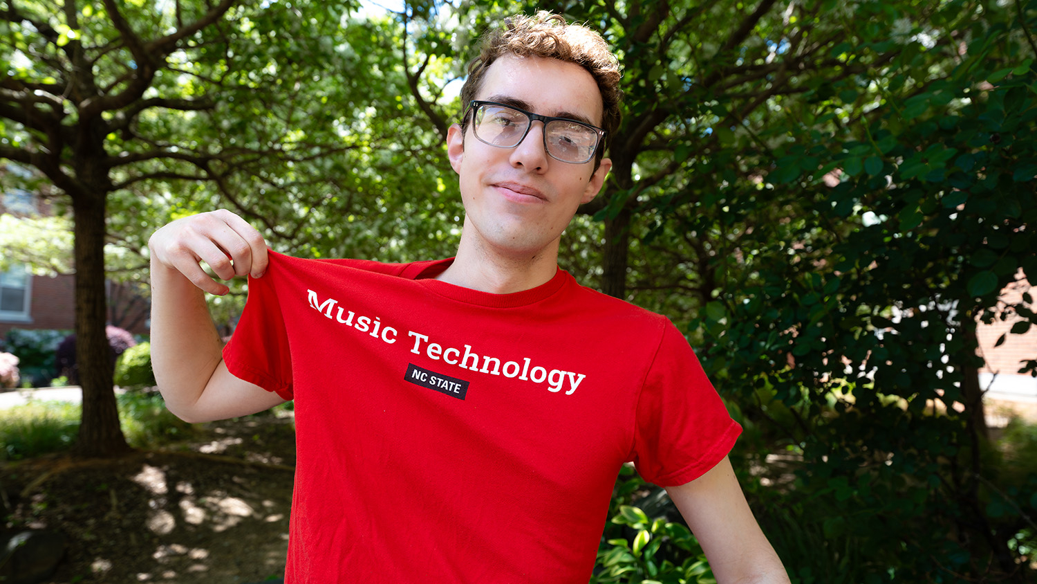 Thomas Reid shows off his red music technology t-shirt.