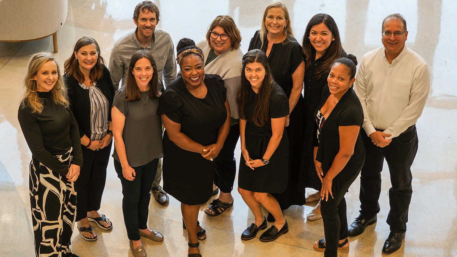 A group of faculty who are part of the NC State Educational Leadership Academies pose for a group photo.