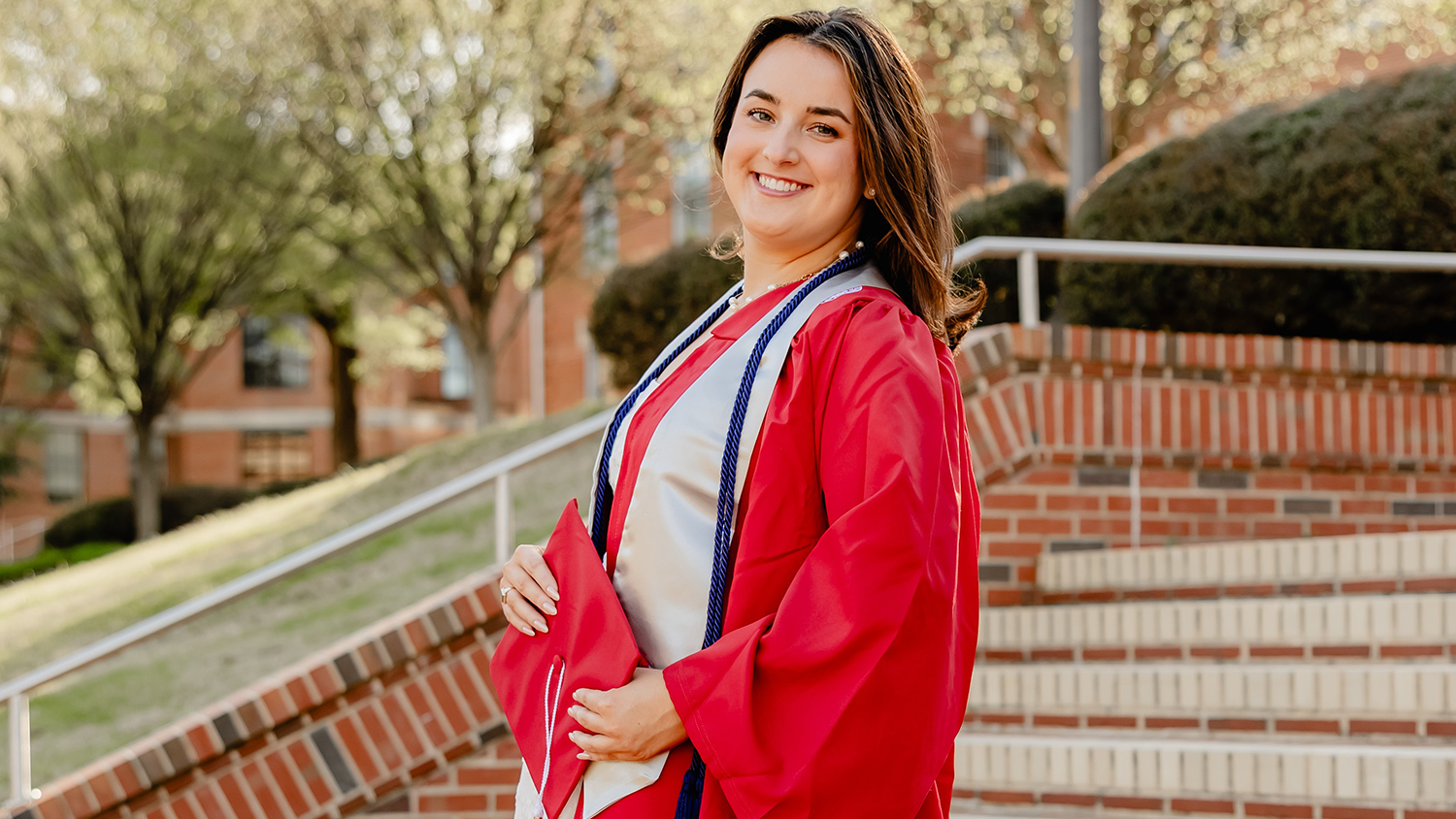 Decorative photo of Olivia Hare in her cap and gown.