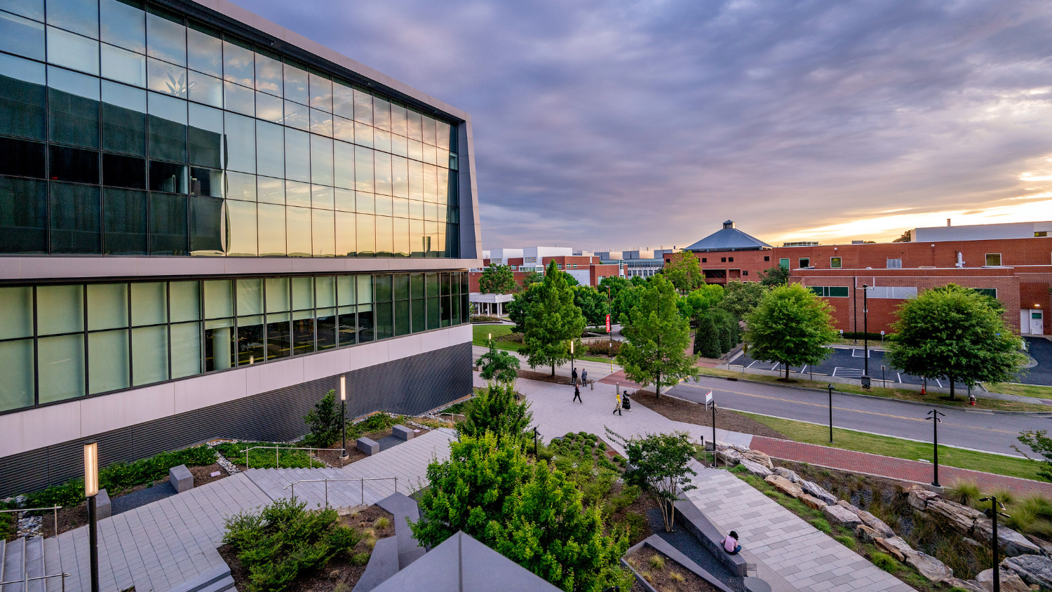 Landscape image of Centennial Campus shows the sun setting on a summer evening.