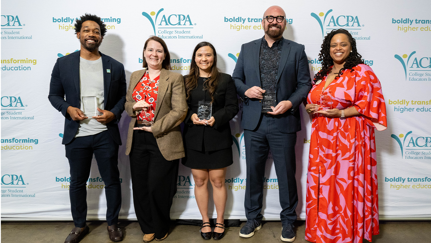 Roshaunda Breeden stands with a group of fellow ACPA award winners.