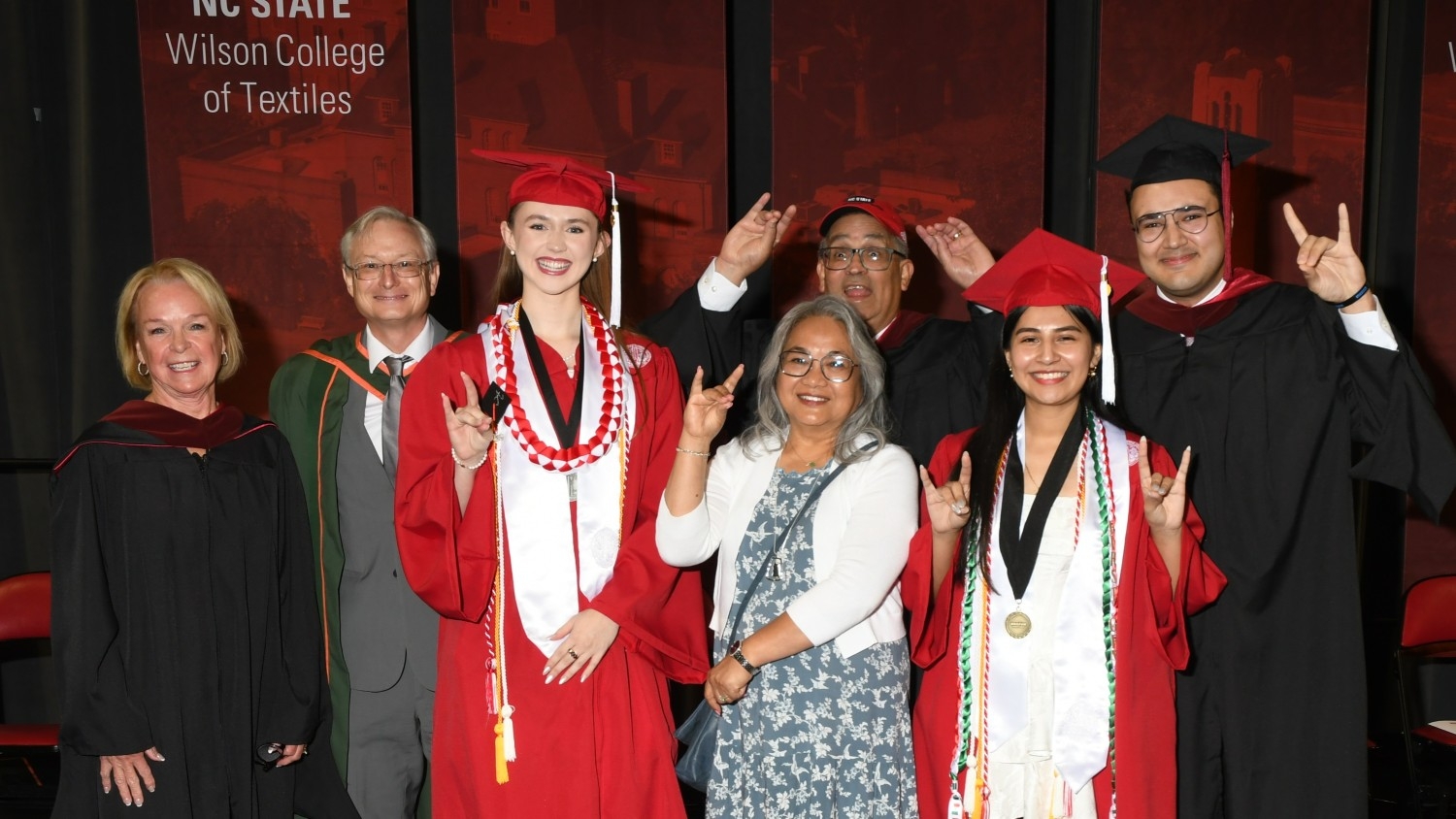 Anil an dMarilyn Kochhar celebrate with Dean Hinks and new graduates