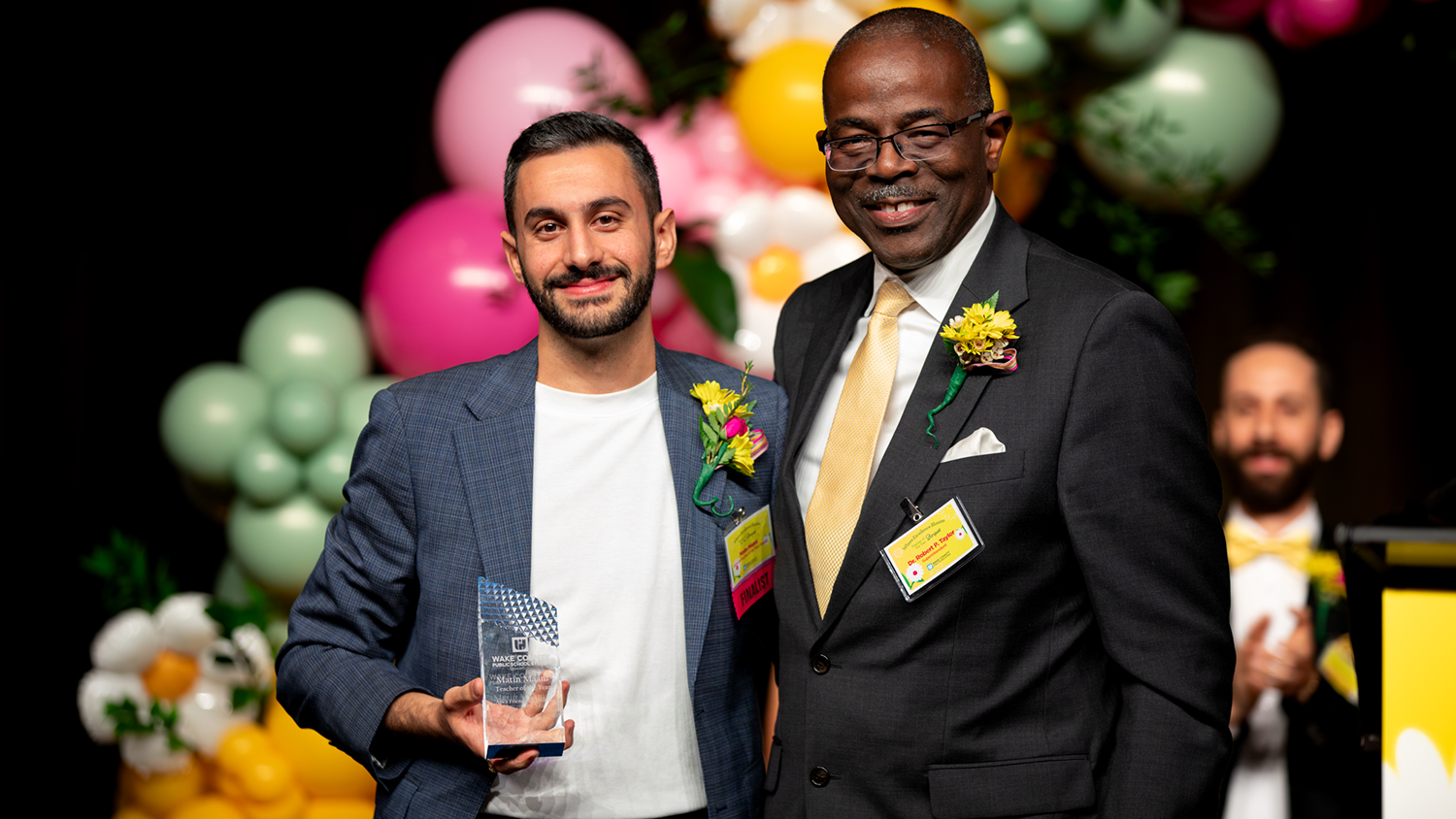 Matin Maani accepts his Wake County Public School System Teacher of the Year award.