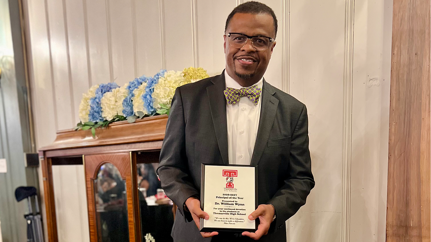 William Wynn III poses with his Thomasville City Schools' Principal of the Year plaque.
