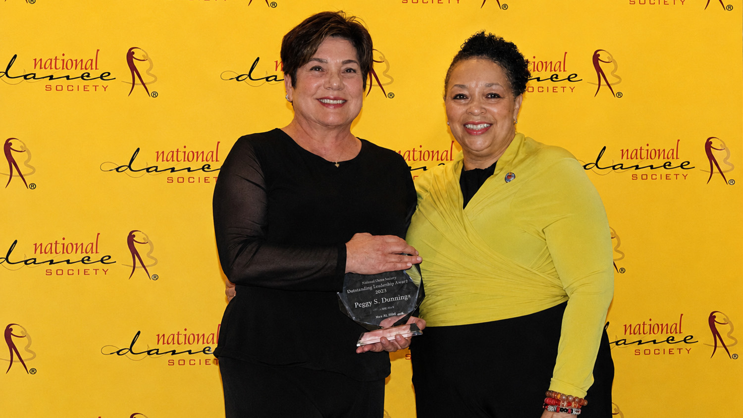 Peggy Domingue receives the Master Dance Educator of the Year Award.