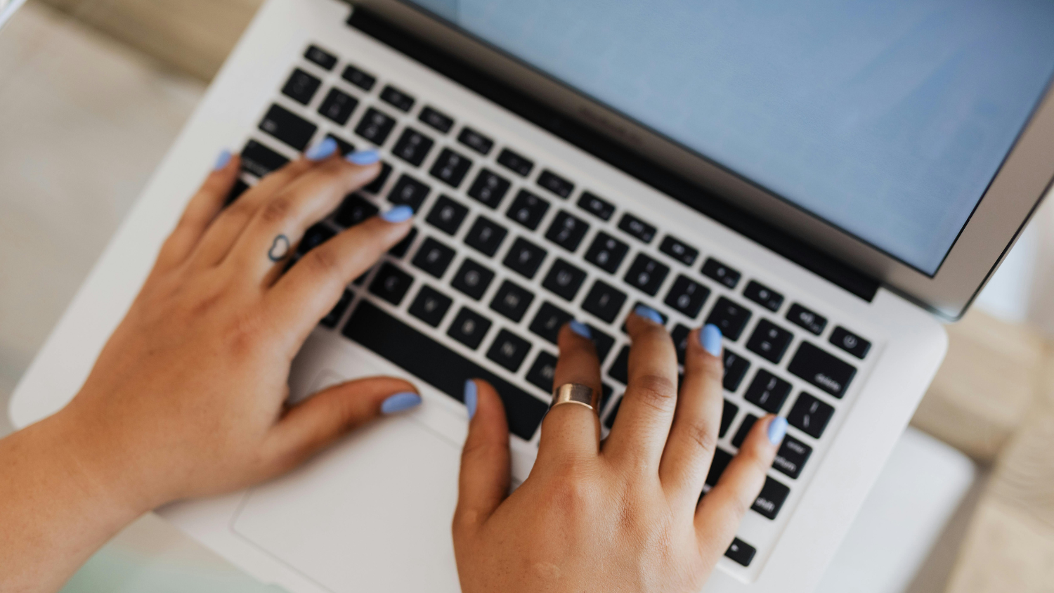 Person typing on laptop