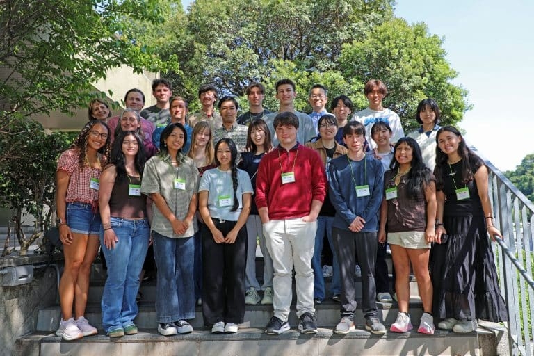 NC State CALS students stand on the stairs of a Nagoya University field site in a rural community in Japan.