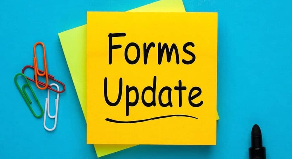 Forms Update written on a Post-it note.
