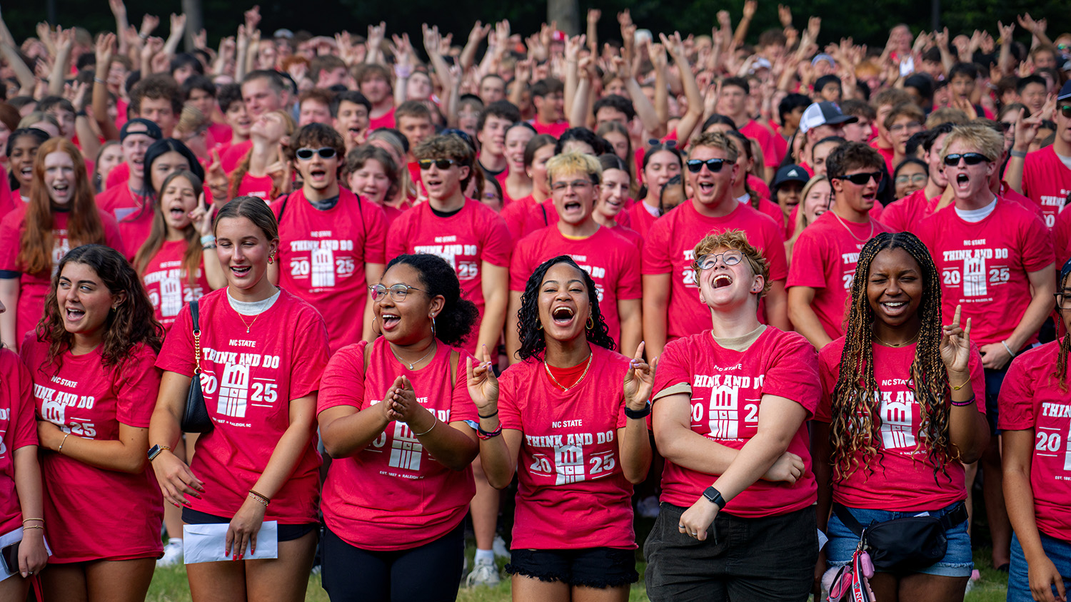 A large group of students in red t-shirts.