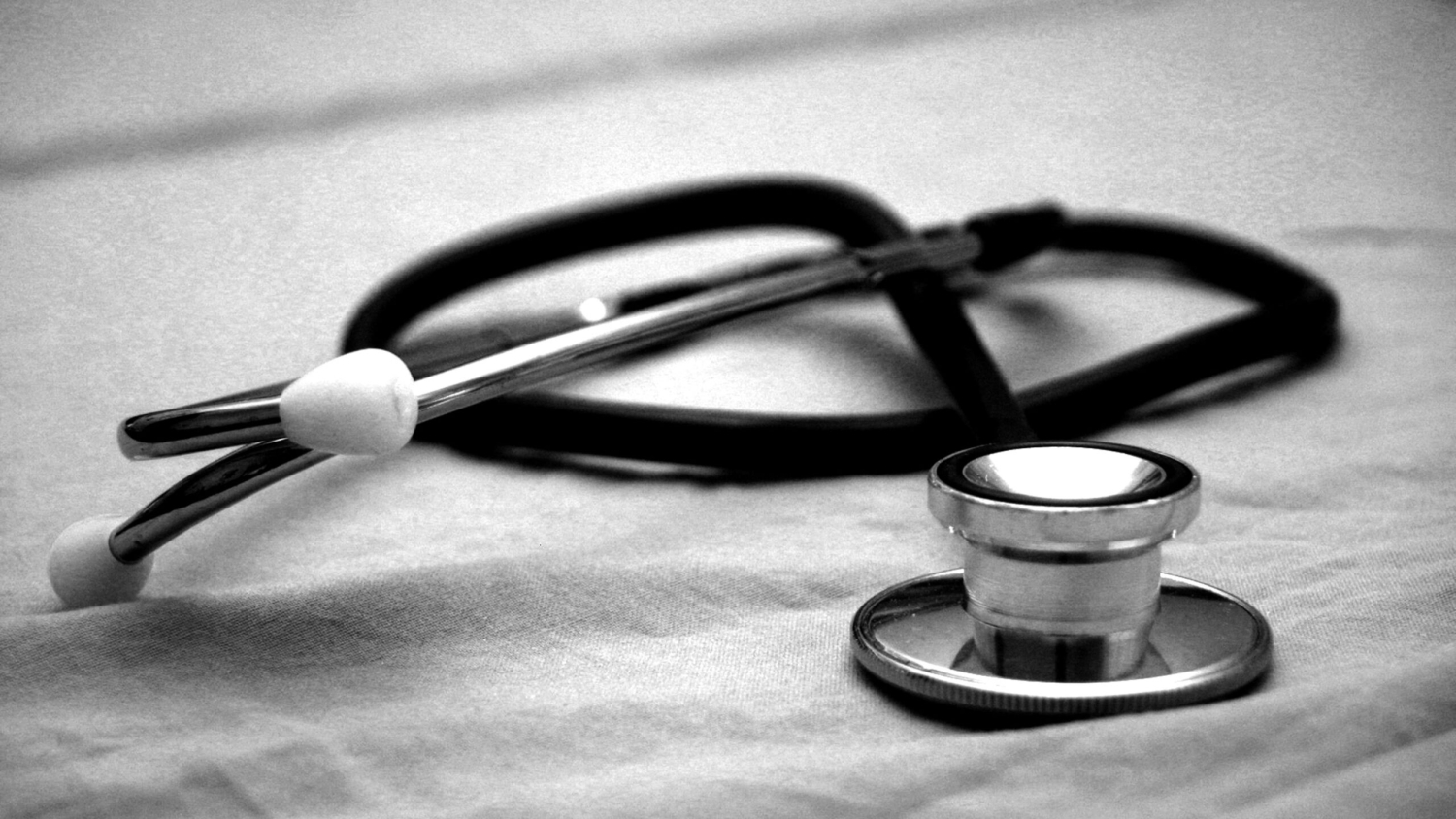 black and white photo of stethoscope