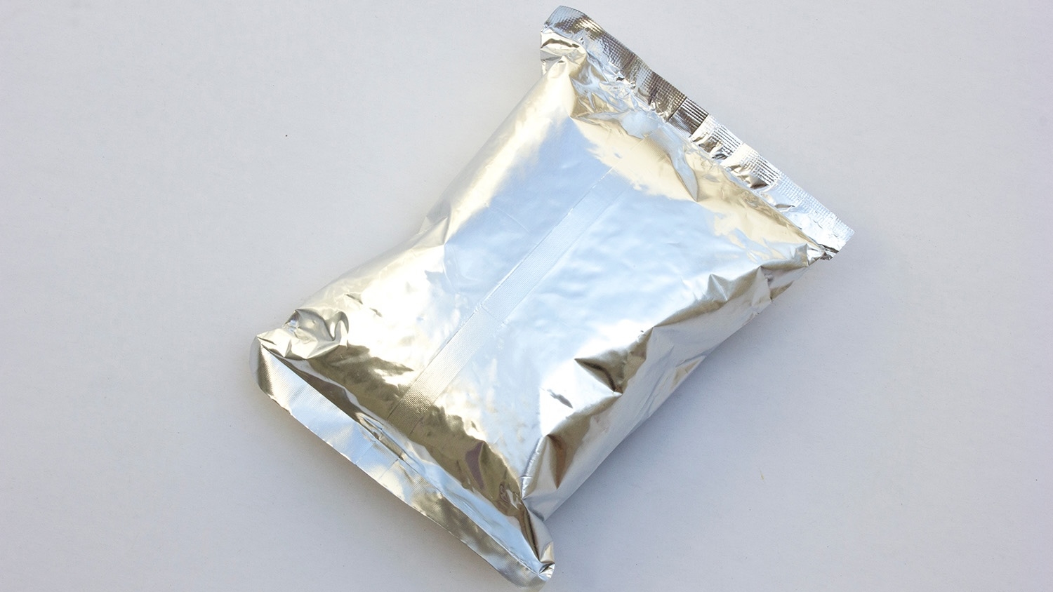 A sealed silver foil snack bag is shown on a plain white background.