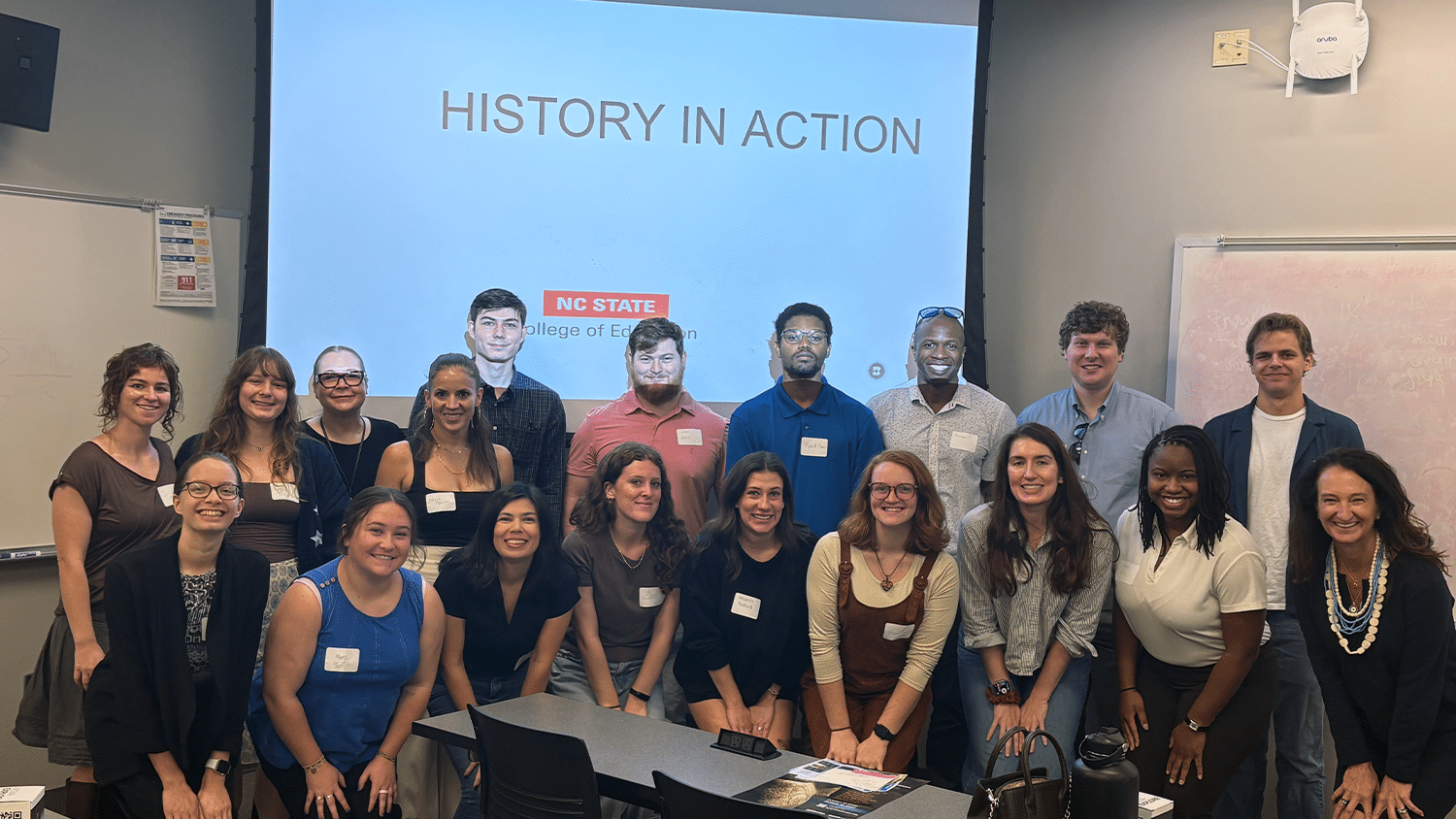 A group of NC State College of Education students pose together for a group photo at the History in Action event.